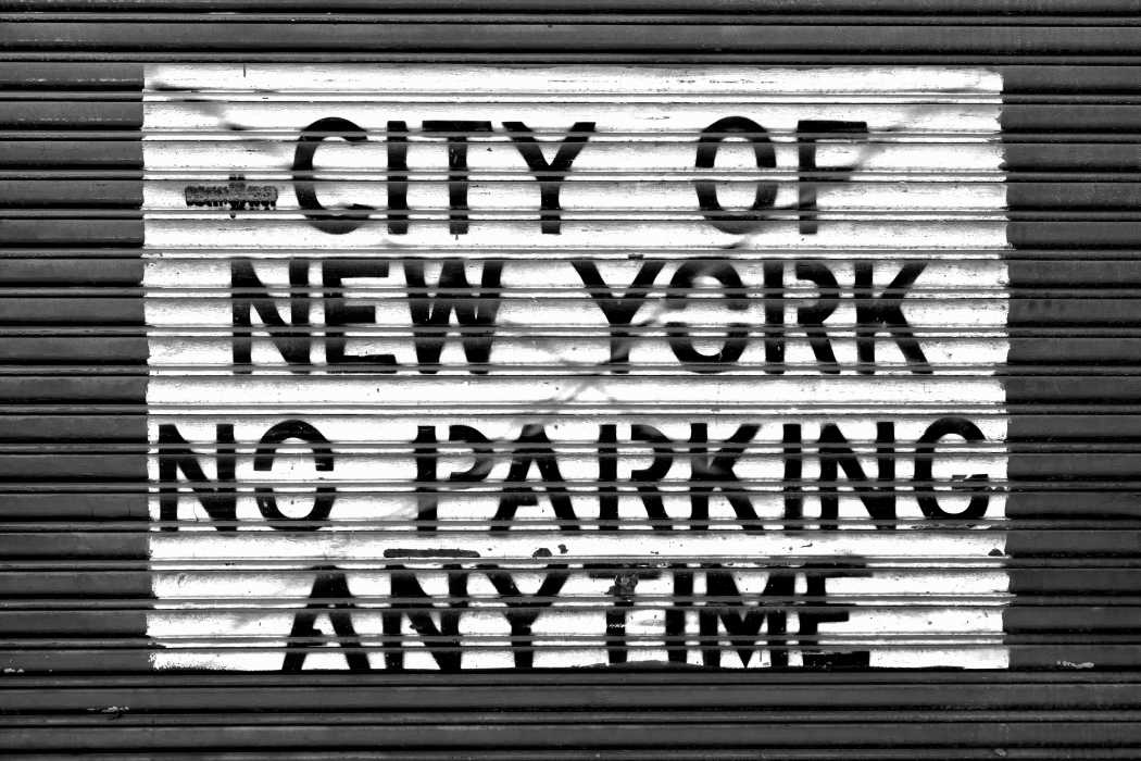 Black and white no parking sign