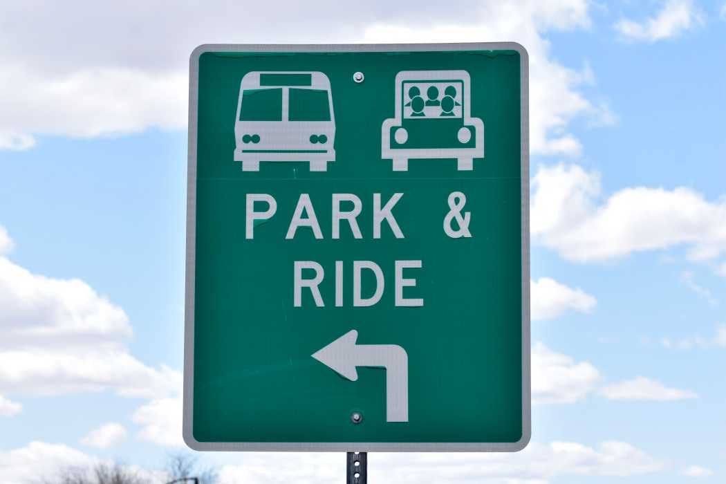 Green and white park and ride sign.