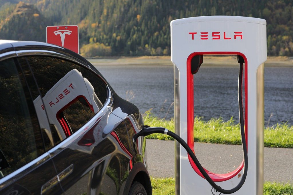 Tesla Model X plugged in at a charging station