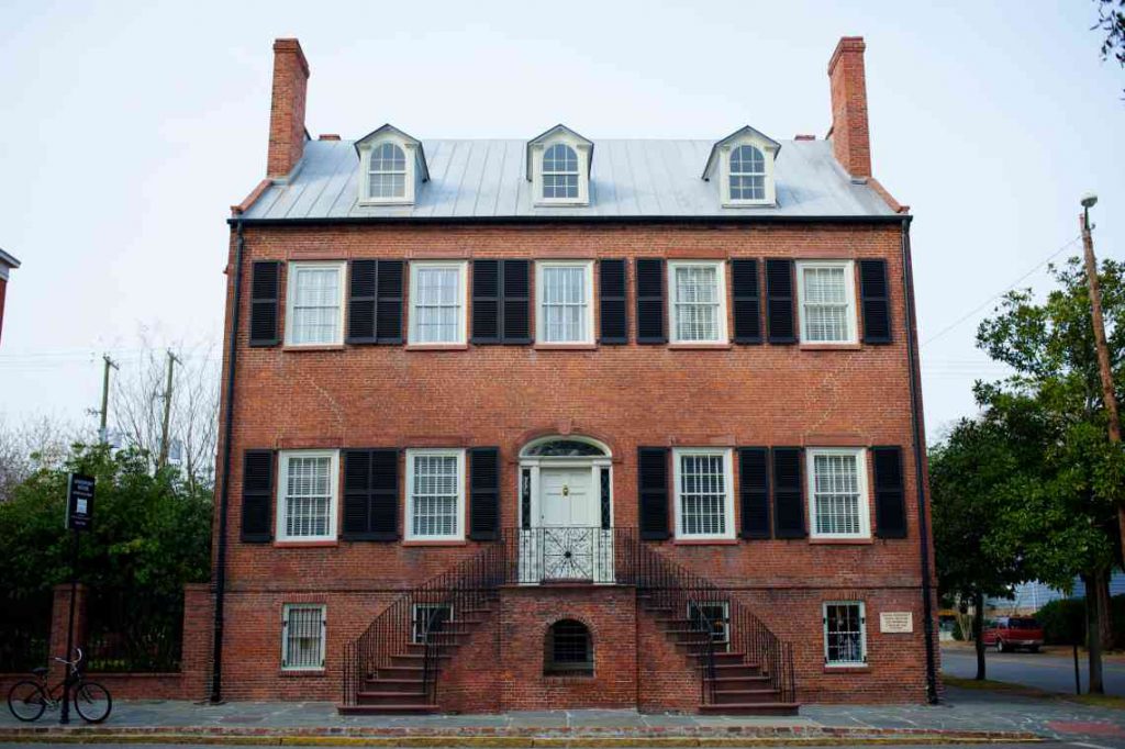 Red brick house with black shutters called the Davenport House