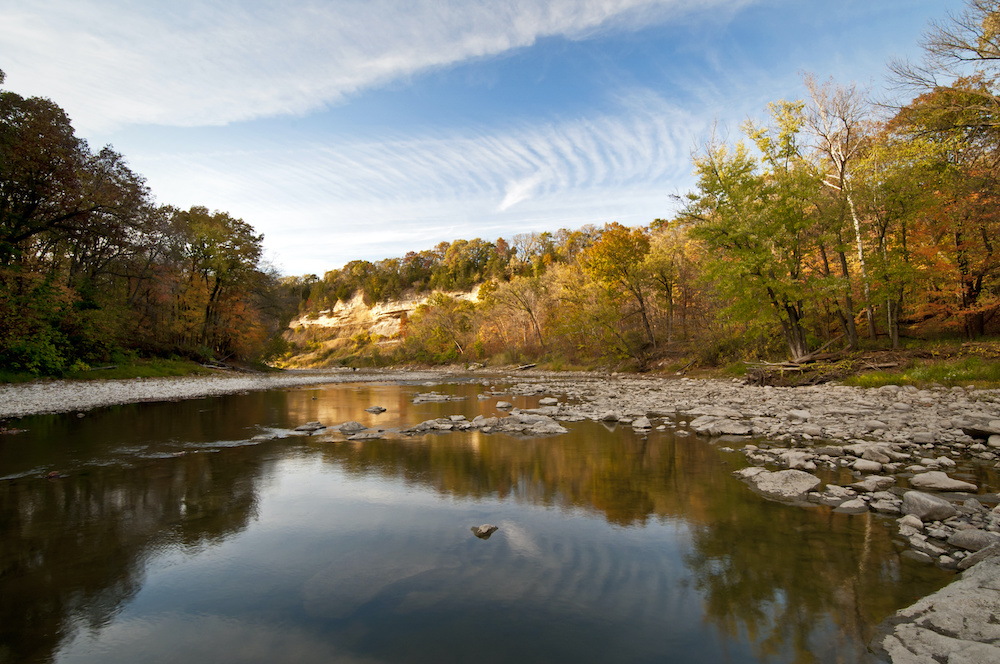 Fall color on the Vermillion River as it runs through Matthiessen State Park near Ottawa, Illinois. | Glamping Destination | SIXT