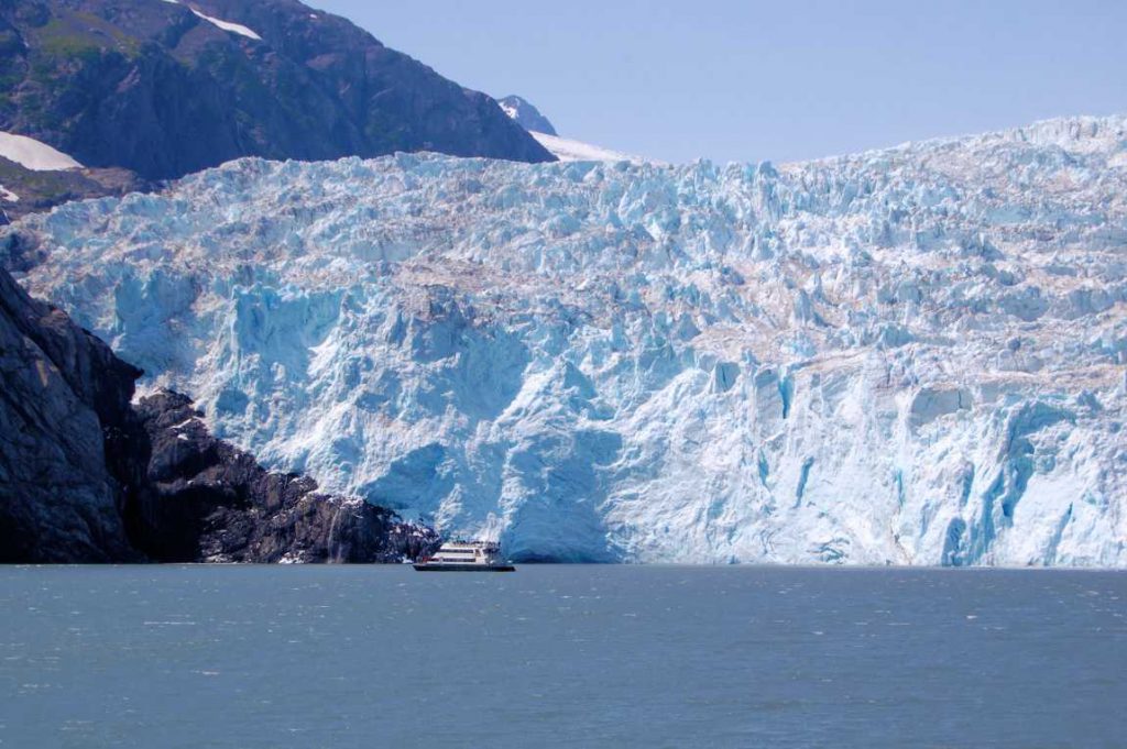 Giant glacier with sightseeing boat