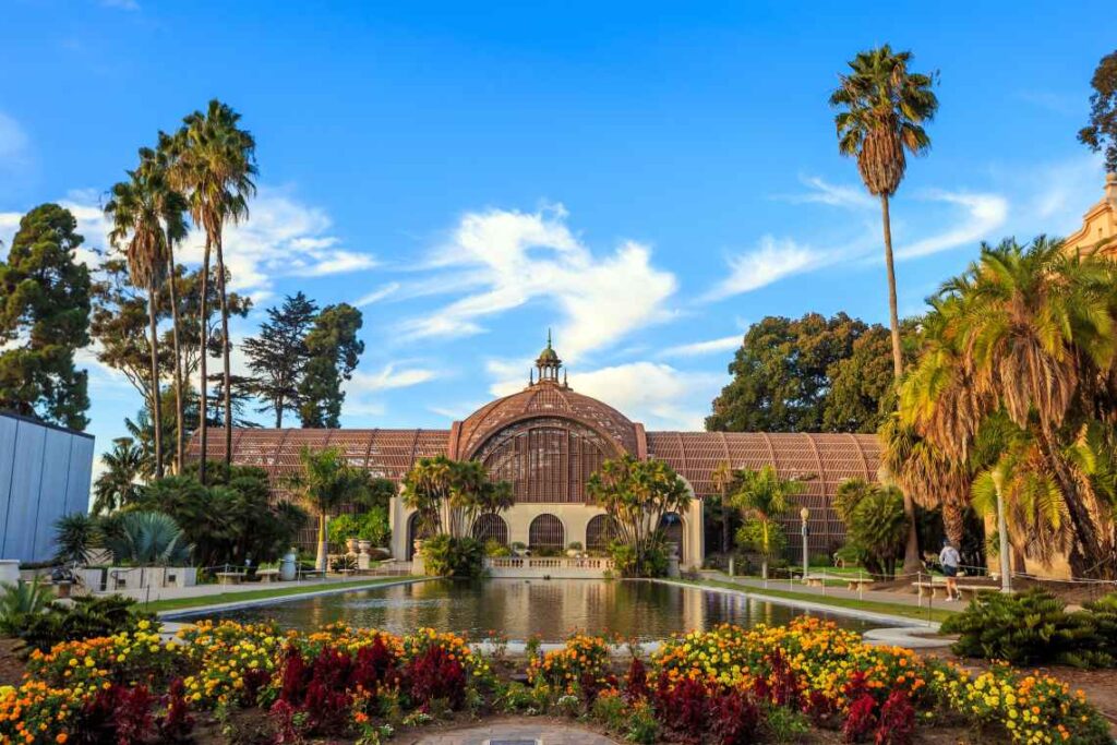 botanical garden and pond with large greenhouse