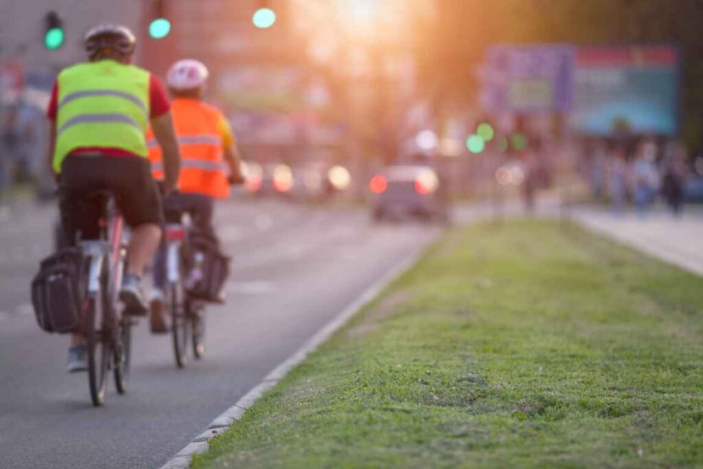 Bike riders with reflective vests and helmets.