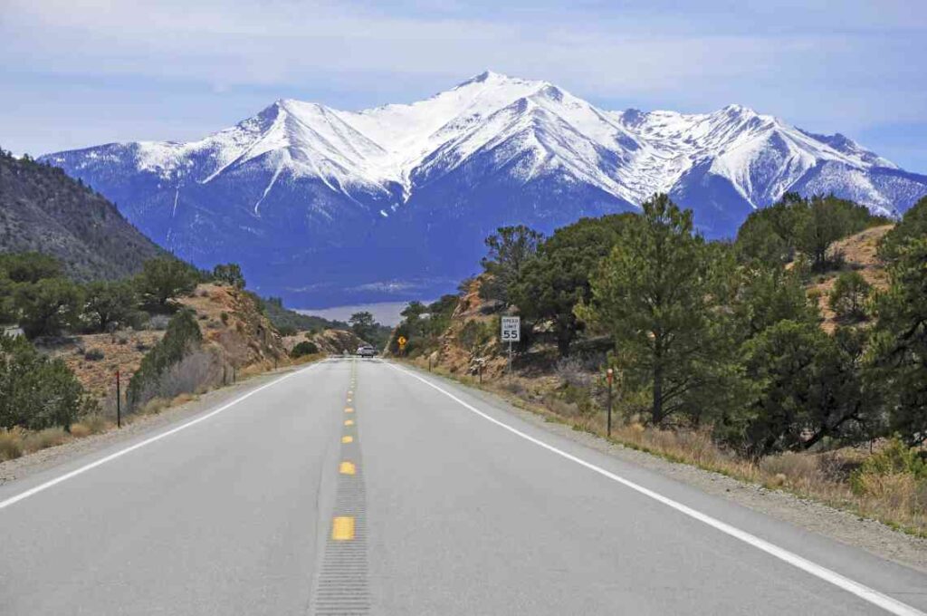 two lane highway toward the rocky mountains