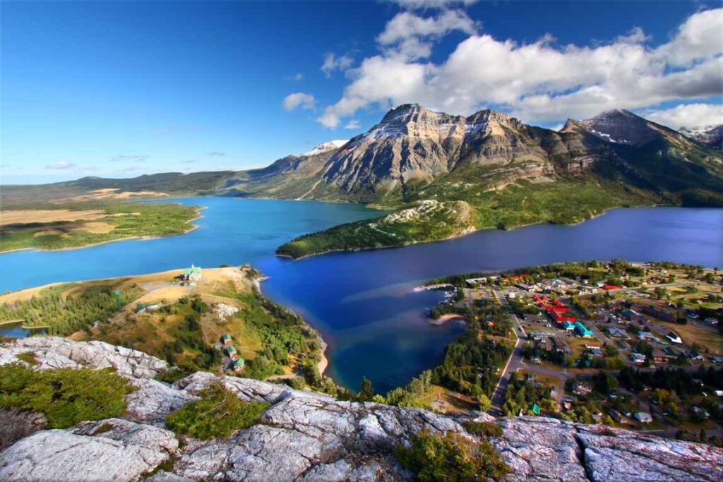 A lake and mountains, plus part of a town in Waterton Lakes National Park