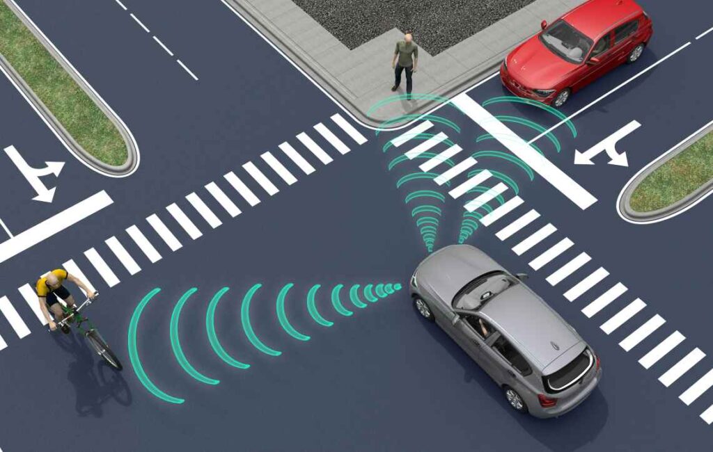 Illustration of self-driving car sensing pedestrians and cyclists on a road