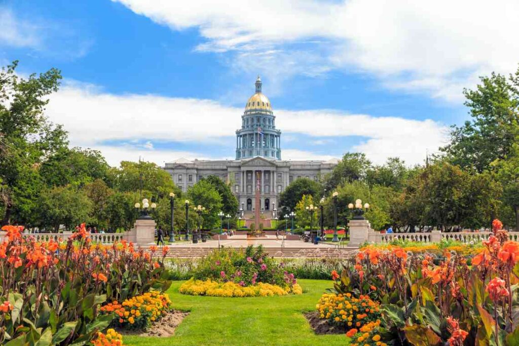 colorful flowers in front of the capitol building with shiny gold dome