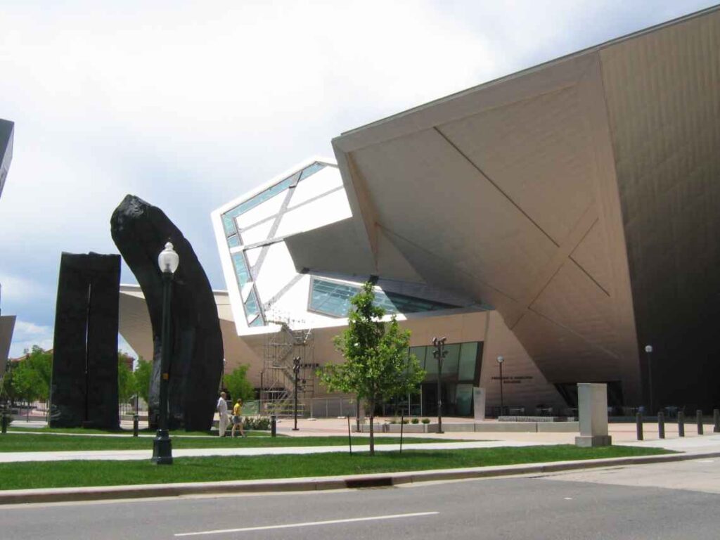 exterior of art museum with black sculptures in front