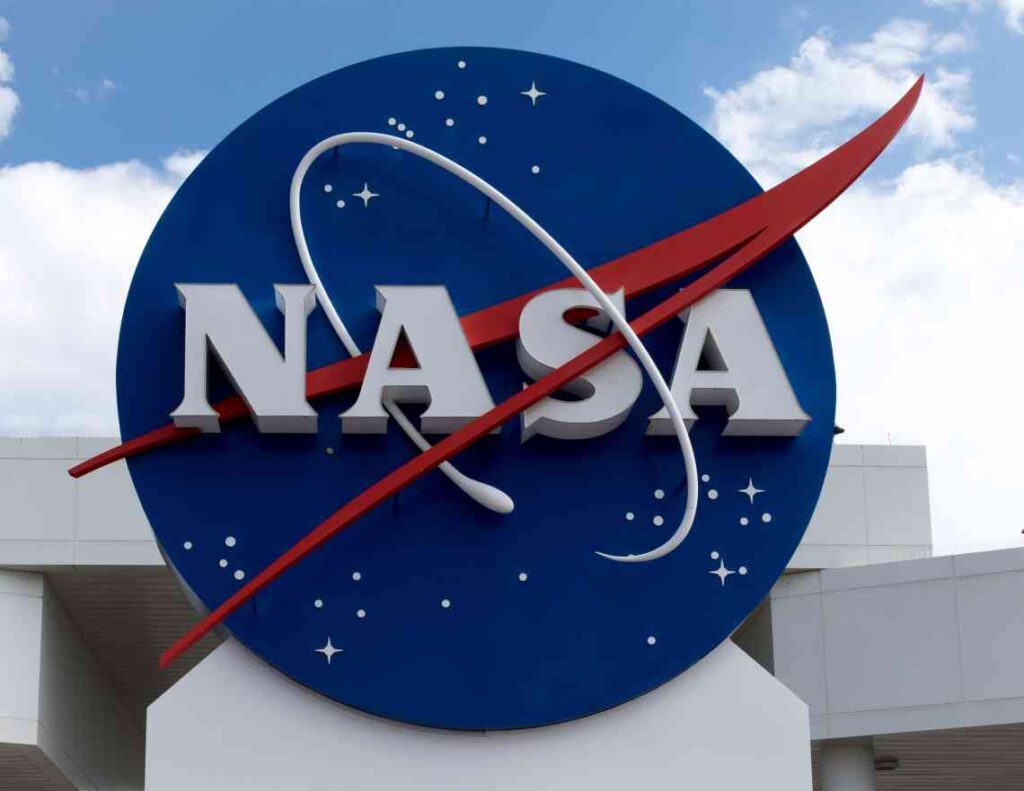 Red white and blue round NASA sign