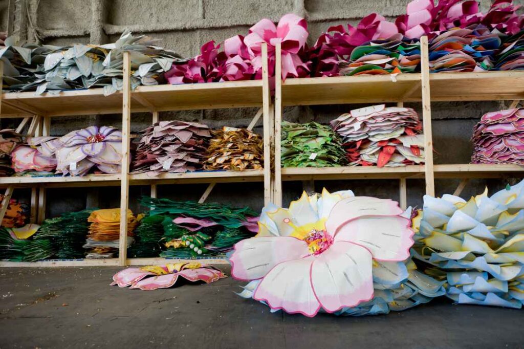 large colorful paper flowers stored on shelves