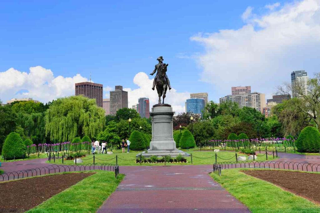 black metal statue of george washington on a pedestal in boston common park