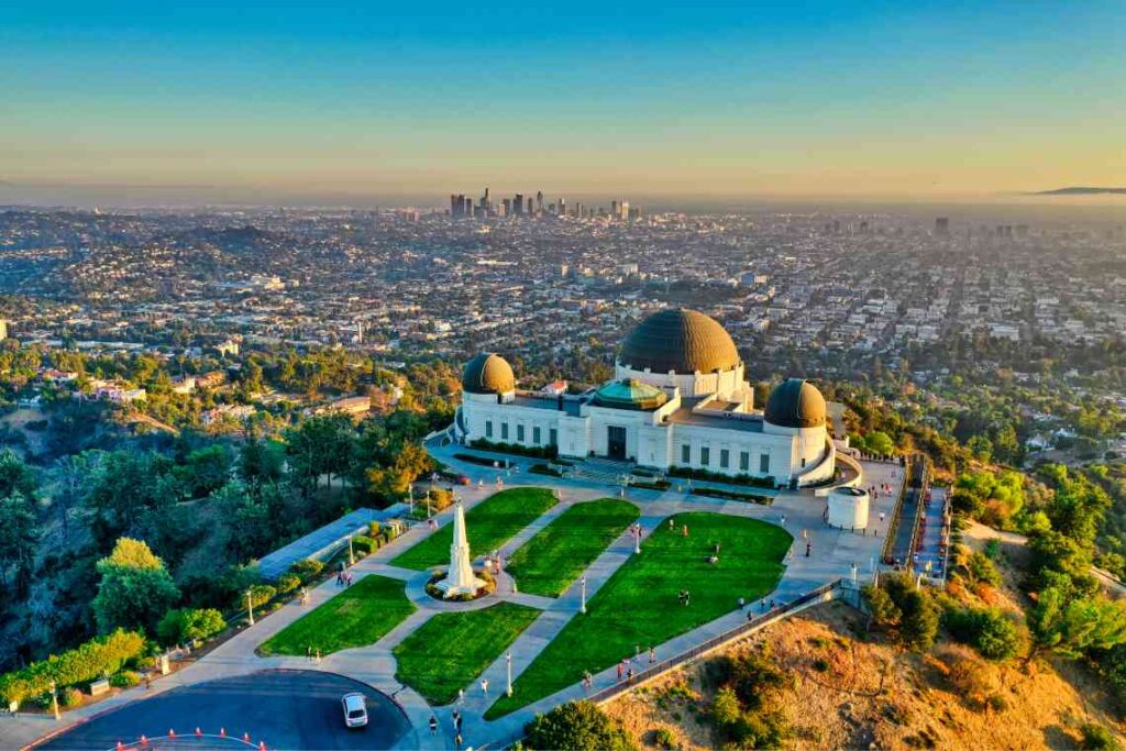 overhead shot of griffith observatory and sprawl of los angeles below