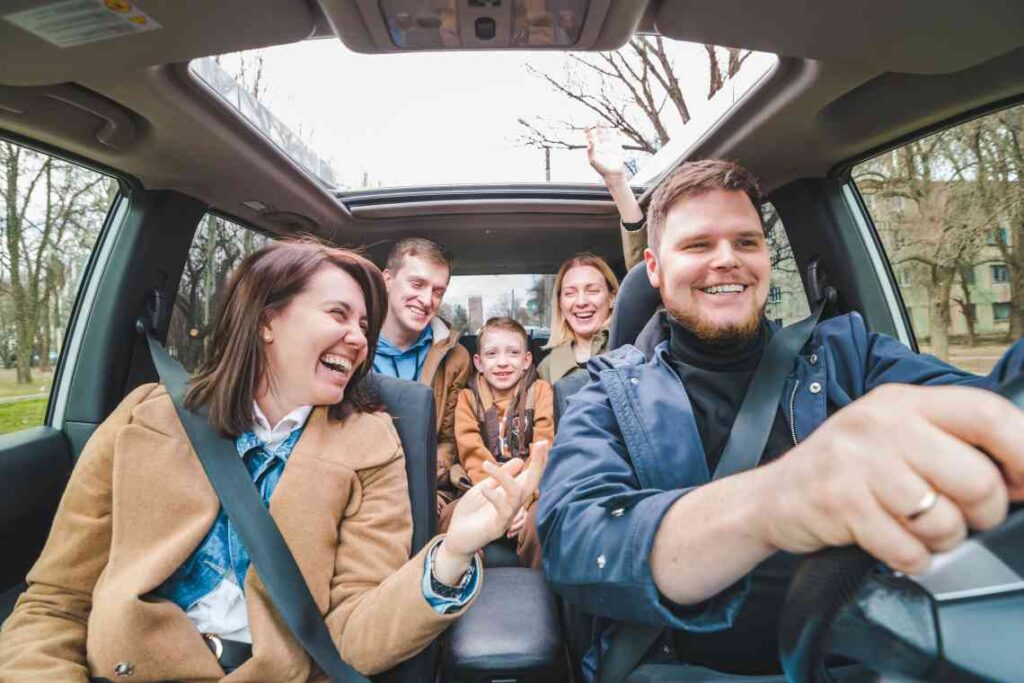 family laughing in car