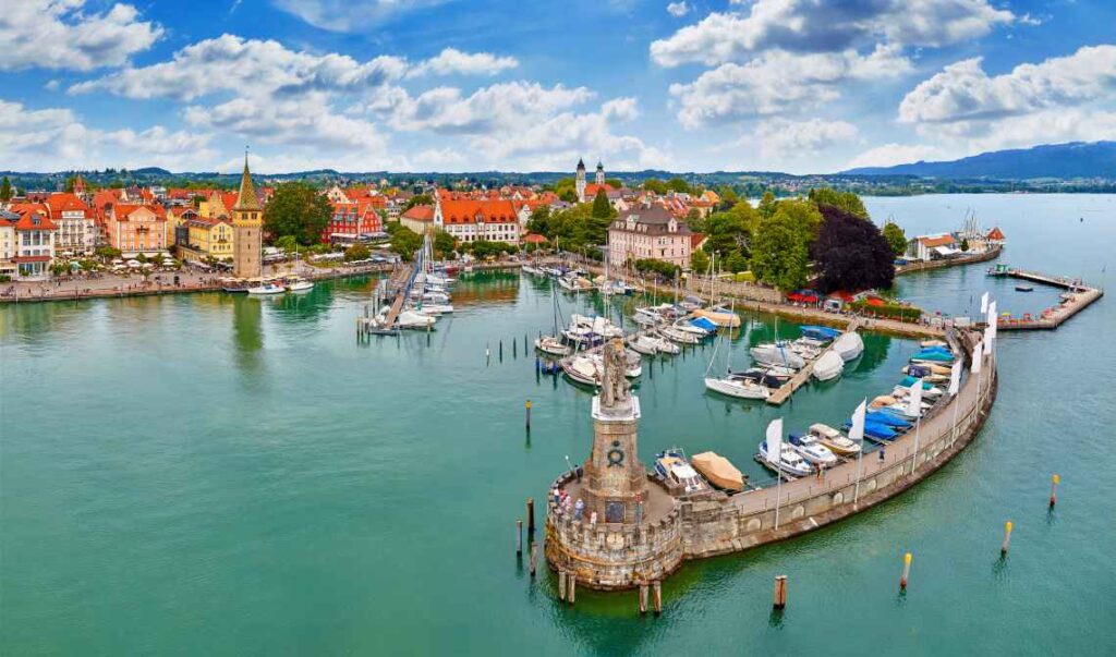 yachts in the harbor of lindau on blue green lake constance