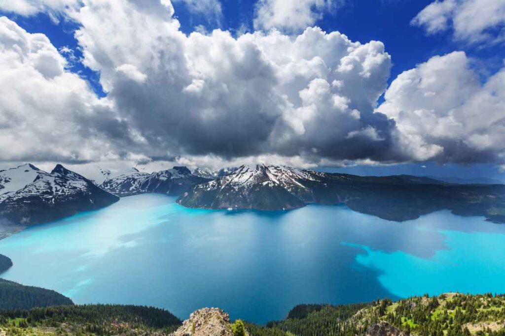 clear blue waters of garibaldi lake sitting among mountains