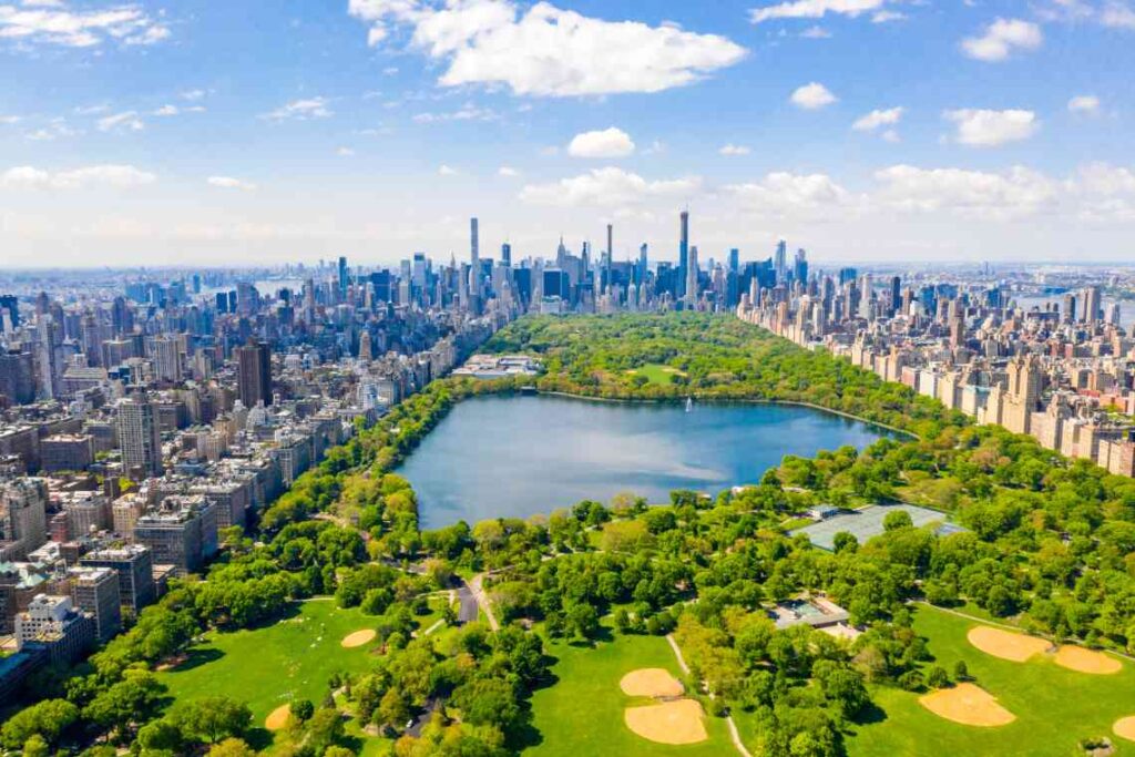 overhead view of central park looking south with baseball fields and the reservoir with skyscrapers in the background