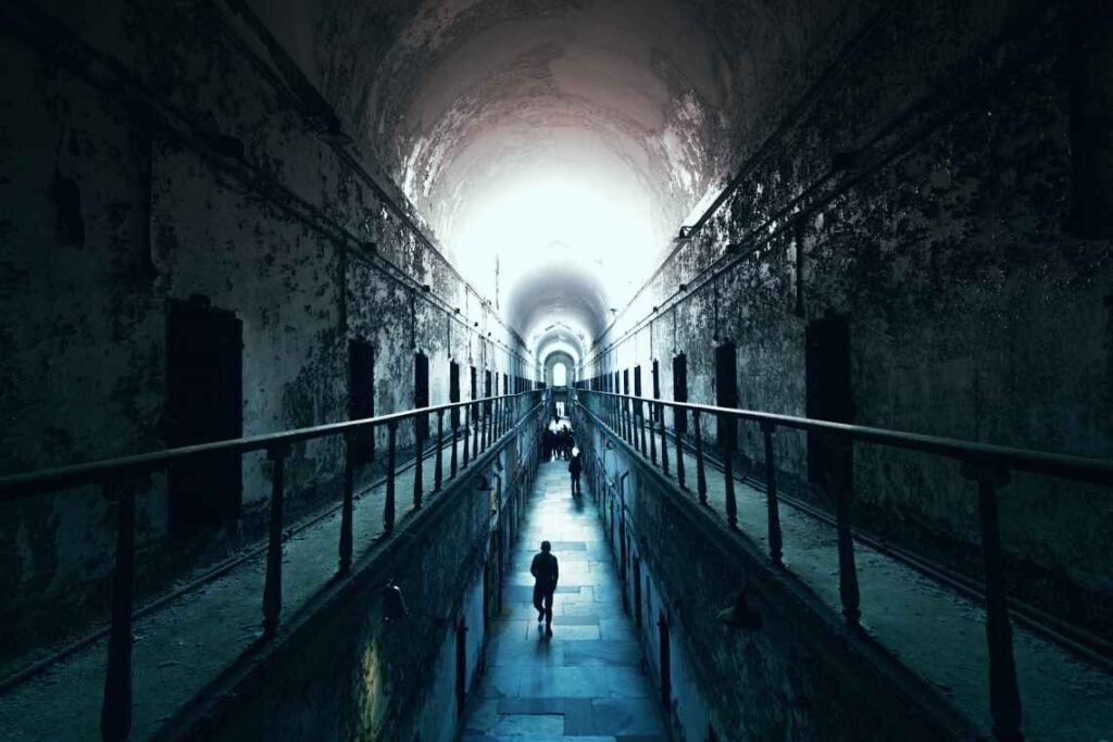 dark view of the cellblock of abandoned eastern state penitentiary