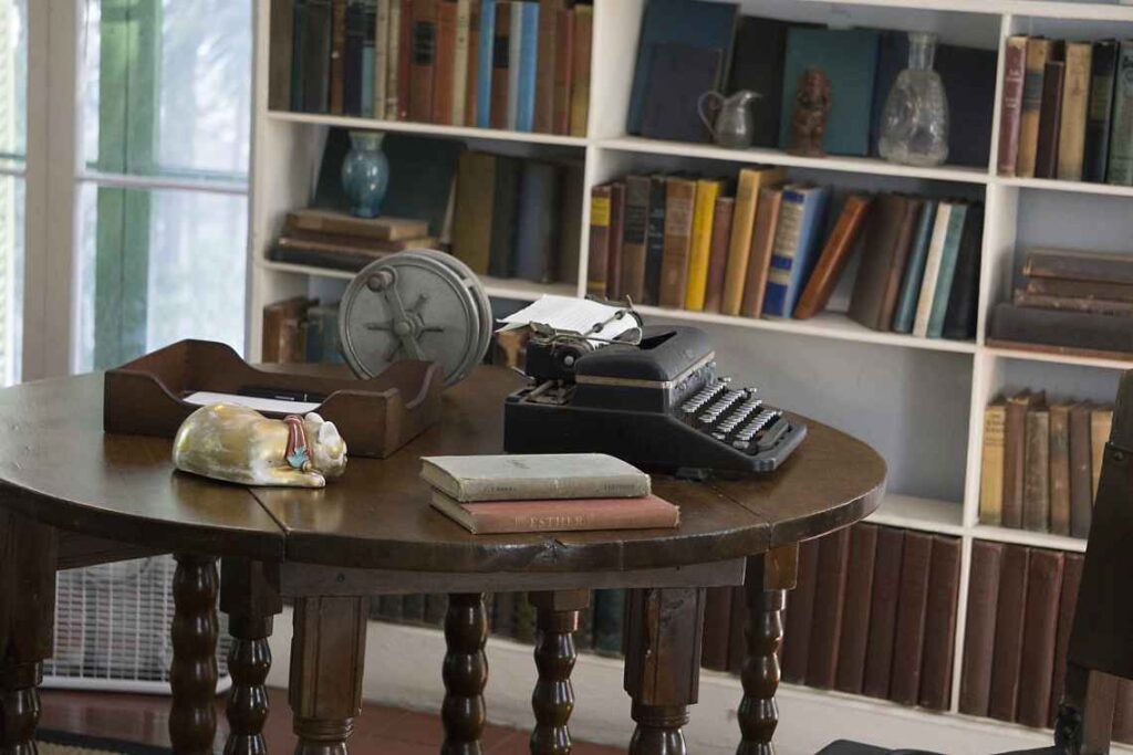 a wooden table with a typewriter where ernest hemingway used to write