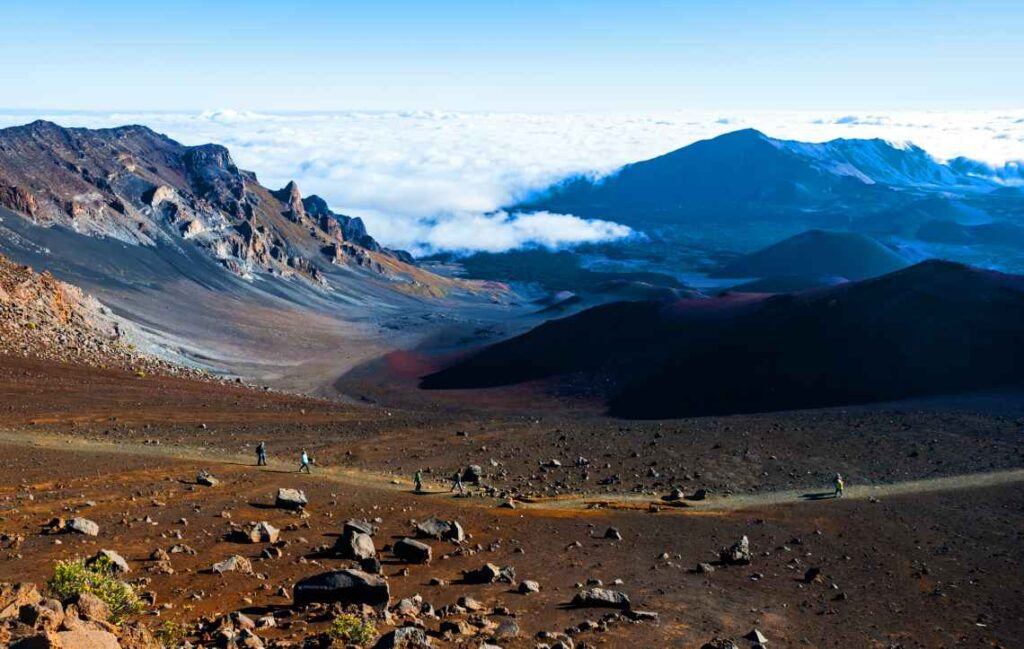 landscape of haleakala national park on maui with people walking below