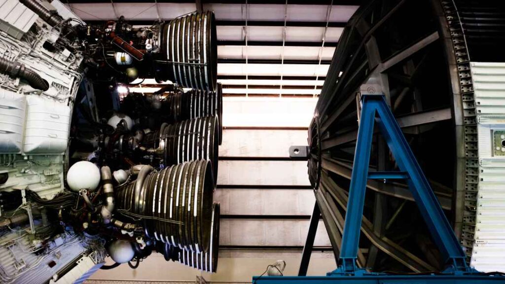 Close up of rocket thruster in front of white wall