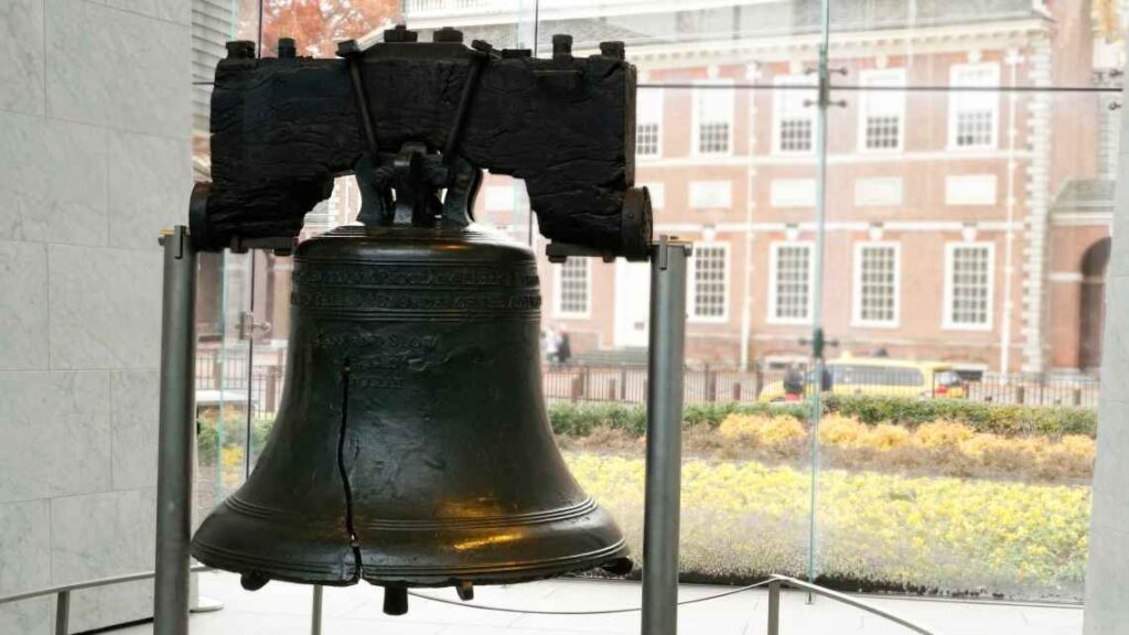 close up of the black metal liberty bell in philadelphia with a crack in it