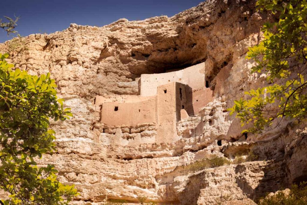 ancient cliff dwellings in pink rock face outside sedona arizona