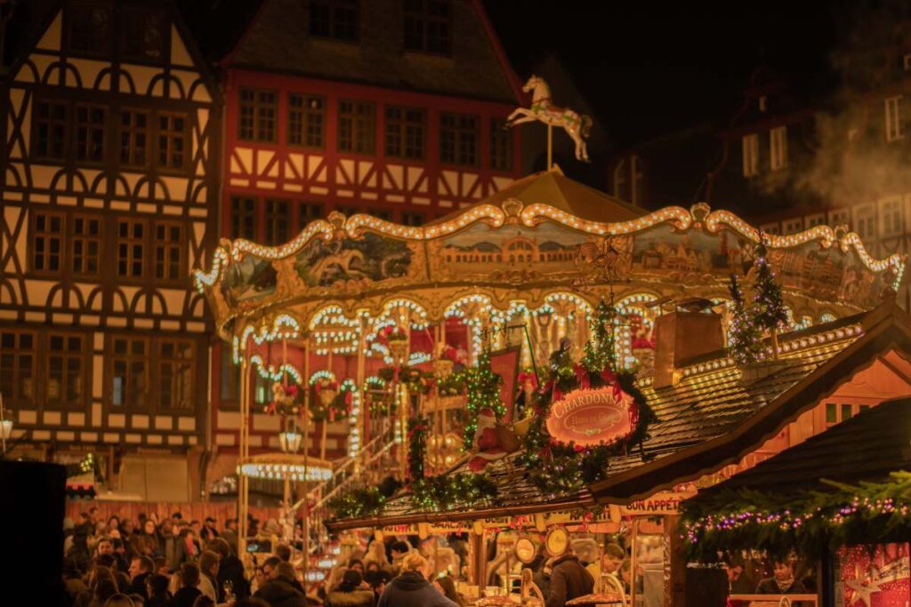 carousel and christmas market stands in the town square of esslingen