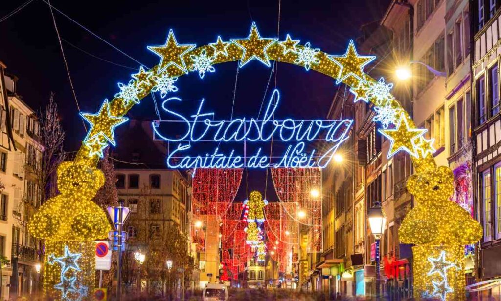 lighted sign entrance to strasbourg christmas market saying strasbourg capitale de noel