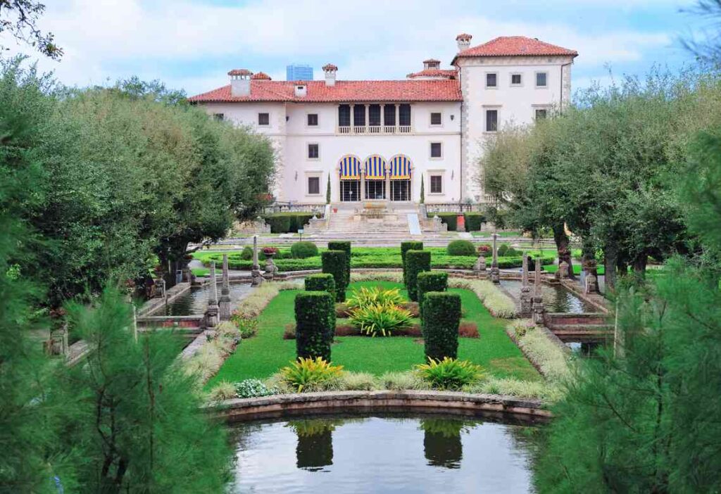 spanish-style vizcaya museum and its manicured gardens with ponds in miami, florida
