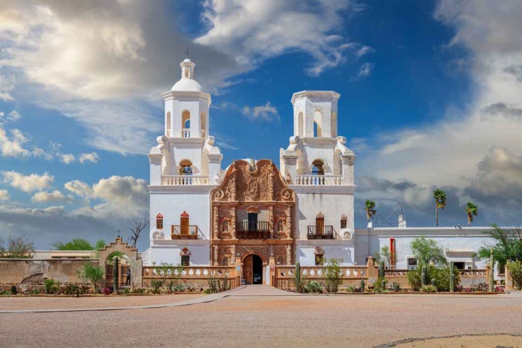 the spanish style white and tan san xavier del bac mission in tucson arizona 