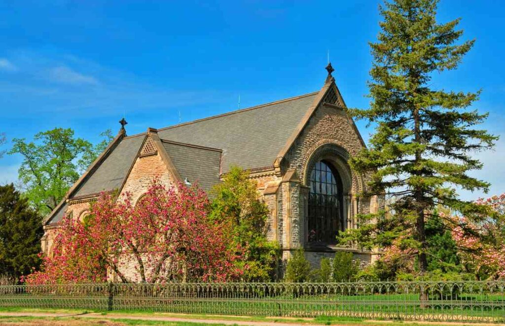 limestone and sandstone chapel with large window in spring grove cemetery in cincinnati