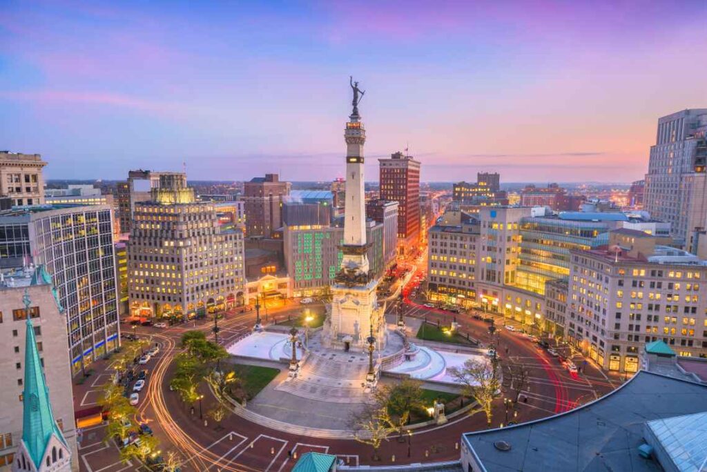 The soldier and sailor monument in the monument traffic circle at dusk in indianapolis