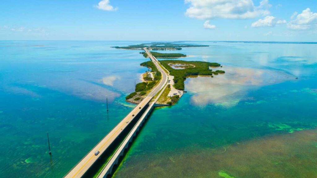 long two lane highway over clear blue green water to the florida keys