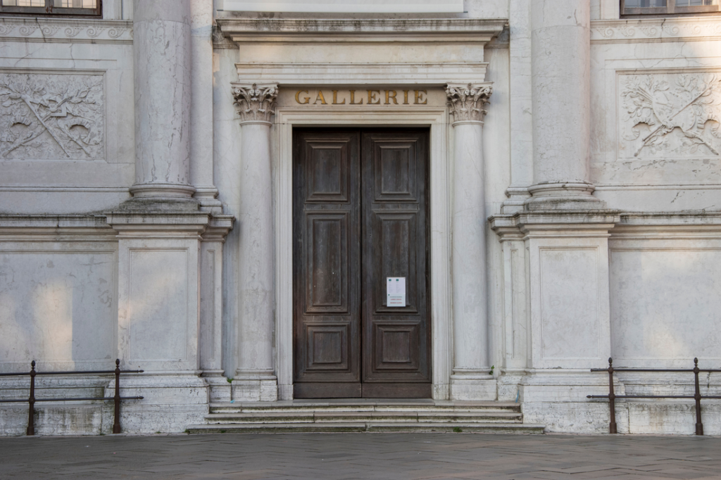brown wood door of the accademia galleries building in venice