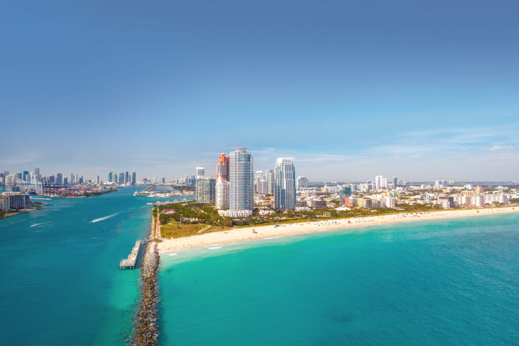 south beach in miamia florda, view from above in direction of the skyline miami, sunny day, clear blue water