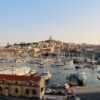 White boats docked along a quay in Marseille