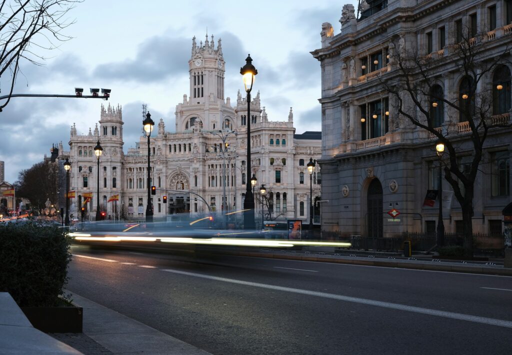 Evening traffic in Madrid city center with light trails