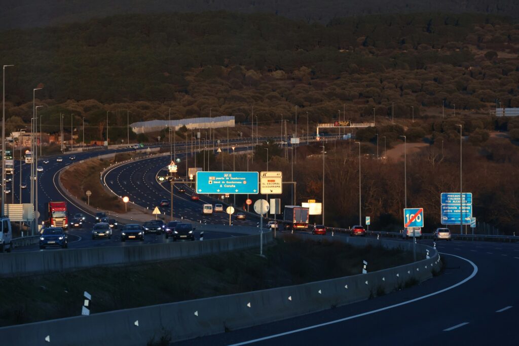 A highway with a lot of traffic on it in Guadarrama, Spain.