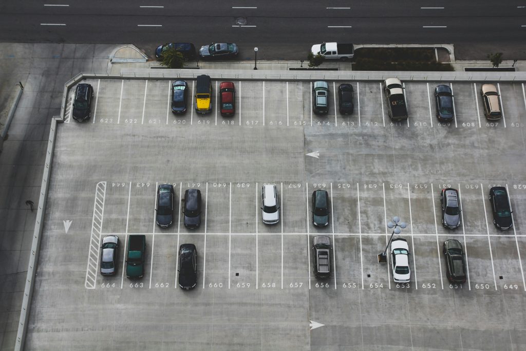 Aerial view of cars parked in a parking lot.