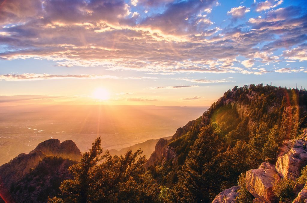 Sunset over the Sandia Mountains with panoramic views of the valley below.
