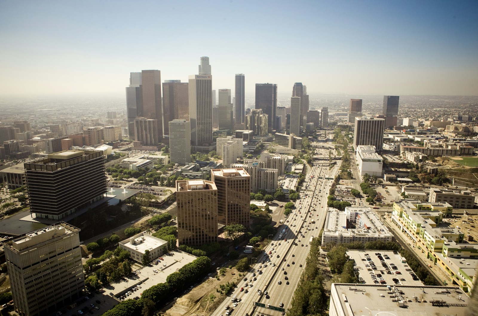 Aerial view of traffic on the 110 freeway leading toward the downtown Los Angeles skyline